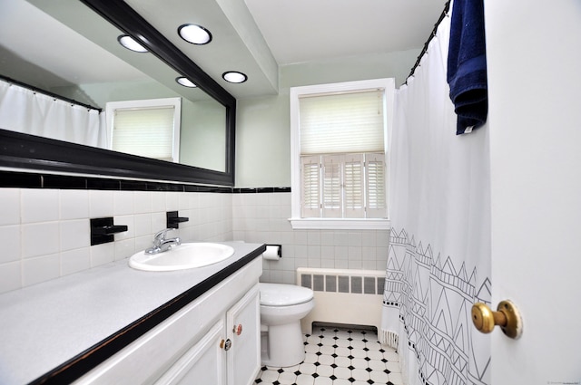 6 Lennox Ave, Windsor, CT 06095 - full bath featuring radiator heating unit, vanity, tile walls, curtained shower, and wainscoting