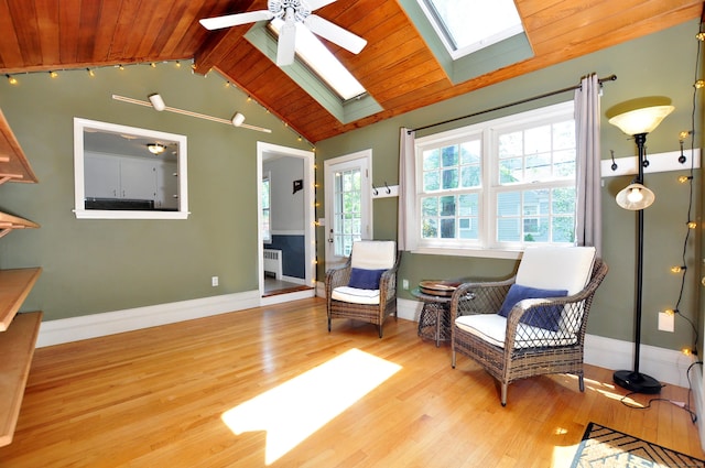 6 Lennox Ave, Windsor, CT 06095 - sitting room featuring radiator heating unit, wood ceiling, wood finished floors, a skylight, and ceiling fan