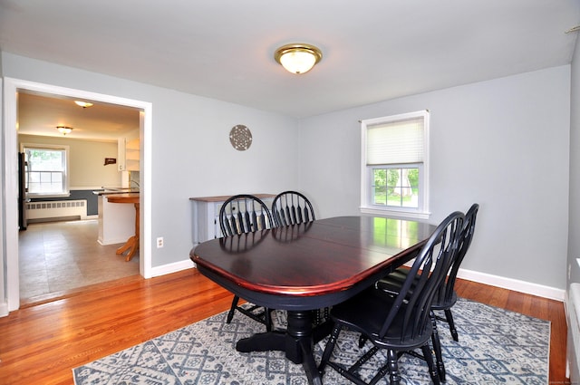 6 Lennox Ave, Windsor, CT 06095 - dining space featuring radiator heating unit and wood finished floors