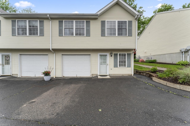 56 Pembroke Rd Apt 11, Danbury, CT 06811 - view of property featuring driveway and a garage