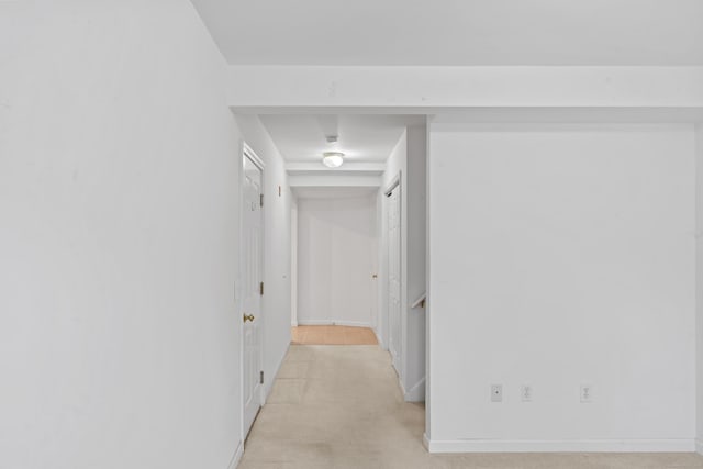 56 Pembroke Rd Apt 11, Danbury, CT 06811 - hallway featuring light carpet and baseboards