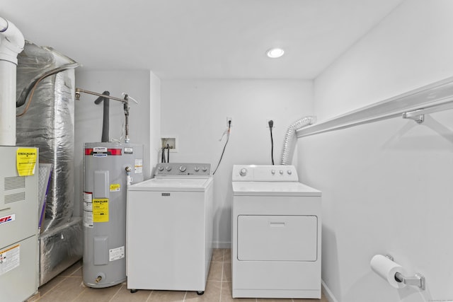 56 Pembroke Rd Apt 11, Danbury, CT 06811 - laundry room with water heater, washer and dryer, and light tile patterned floors