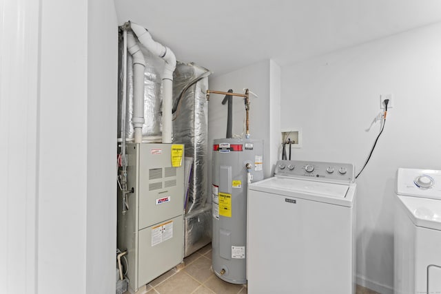 56 Pembroke Rd Apt 11, Danbury, CT 06811 - washroom with electric water heater, washing machine and clothes dryer, and light tile patterned floors