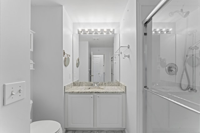 56 Pembroke Rd Apt 11, Danbury, CT 06811 - full bathroom with a stall shower, vanity, and toilet