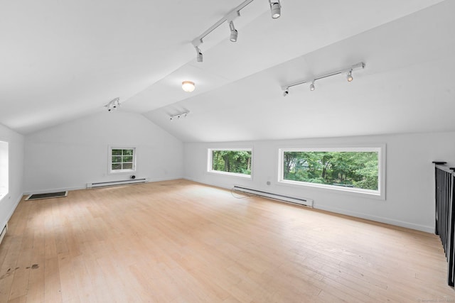 2921 Nichols Ave, Trumbull, CT 06611 - bonus room featuring a baseboard radiator, lofted ceiling, plenty of natural light, and hardwood / wood-style flooring