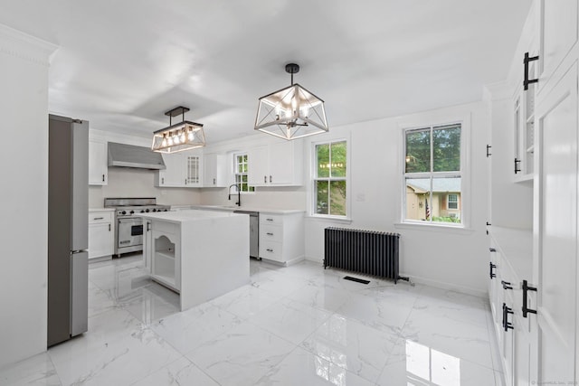 2921 Nichols Ave, Trumbull, CT 06611 - kitchen with appliances with stainless steel finishes, radiator, wall chimney range hood, a chandelier, and light countertops