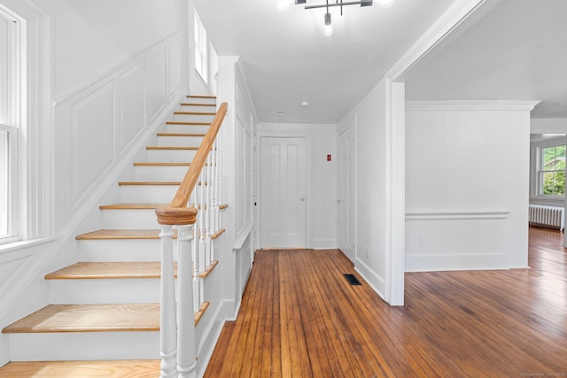 2921 Nichols Ave, Trumbull, CT 06611 - stairway featuring radiator heating unit, wood finished floors, ornamental molding, and baseboards
