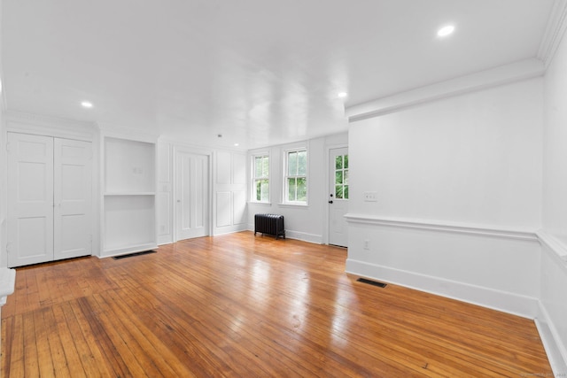 2921 Nichols Ave, Trumbull, CT 06611 - unfurnished living room with radiator heating unit, hardwood / wood-style floors, recessed lighting, and baseboards
