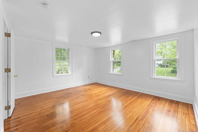 2921 Nichols Ave, Trumbull, CT 06611 - empty room with light wood-type flooring, baseboards, a smoke detector, and plenty of natural light