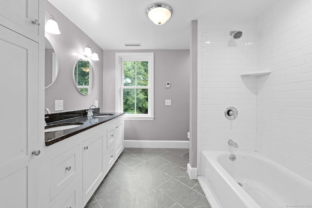 2921 Nichols Ave, Trumbull, CT 06611 - bathroom featuring double vanity, tile patterned flooring, washtub / shower combination, toilet, and baseboards