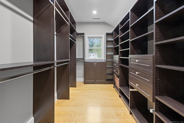 2921 Nichols Ave, Trumbull, CT 06611 - walk in closet featuring light wood-style flooring and vaulted ceiling