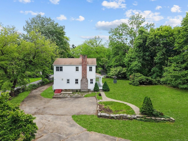 2921 Nichols Ave, Trumbull, CT 06611 - view of front of property with a chimney, a front lawn, and driveway