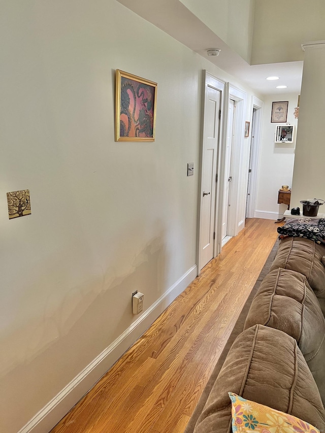 living room with light wood finished floors and baseboards