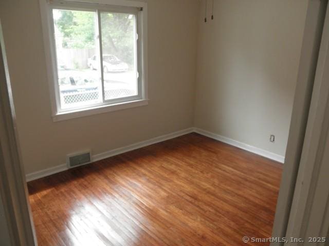 40 Wake St, Bridgeport, CT 06610 - empty room featuring wood finished floors and baseboards