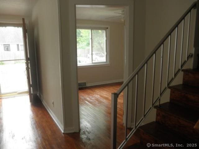 40 Wake St, Bridgeport, CT 06610 - staircase with wood finished floors and baseboards