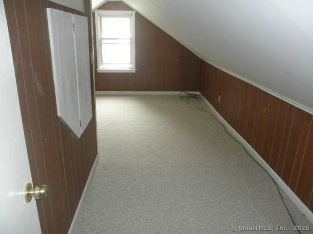 40 Wake St, Bridgeport, CT 06610 - bonus room with carpet, wood walls, lofted ceiling, and baseboards