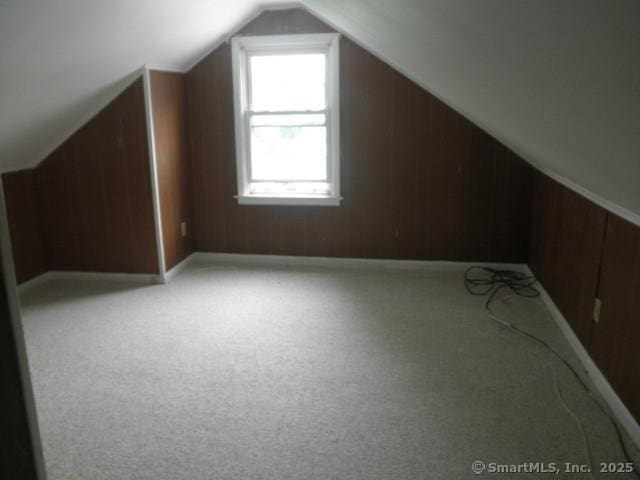 40 Wake St, Bridgeport, CT 06610 - bonus room with vaulted ceiling, light colored carpet, and wooden walls
