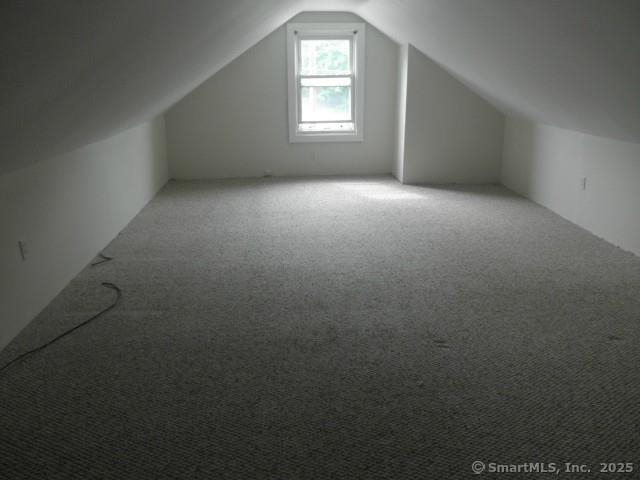 40 Wake St, Bridgeport, CT 06610 - additional living space featuring vaulted ceiling and carpet flooring