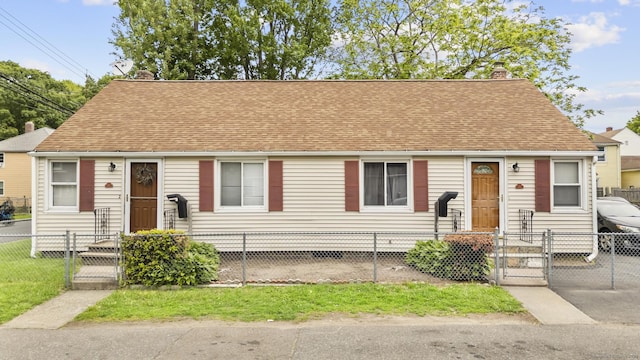 40 Wake St, Bridgeport, CT 06610 - view of front facade with a gate, a chimney, a fenced front yard, and roof with shingles