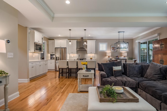 3 Prospect Rdg, Simsbury, CT 06070 - living area with light wood finished floors, healthy amount of natural light, recessed lighting, ornamental molding, and baseboards