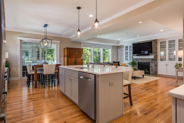 3 Prospect Rdg, Simsbury, CT 06070 - kitchen with dishwasher, a sink, a fireplace, crown molding, and light countertops