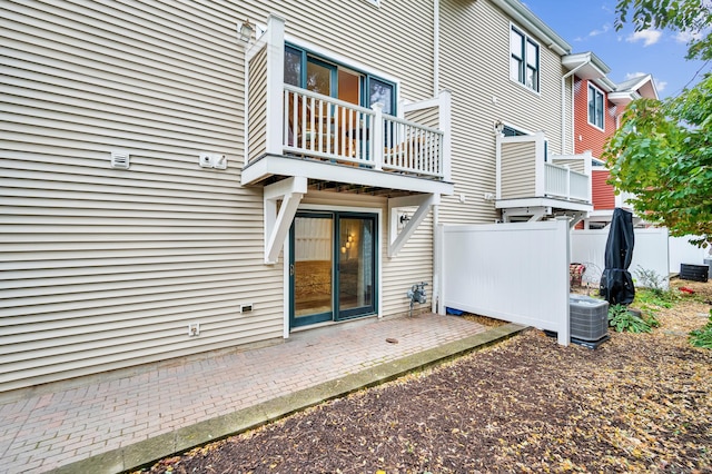 645 Prospect Ave Unit 11, West Hartford, CT 06105 - rear view of house featuring a balcony, central air condition unit, and a patio