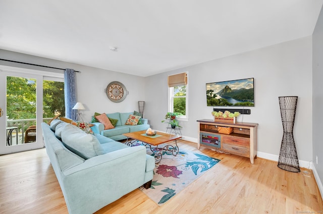 645 Prospect Ave Unit 11, West Hartford, CT 06105 - living area featuring healthy amount of natural light, wood finished floors, and baseboards