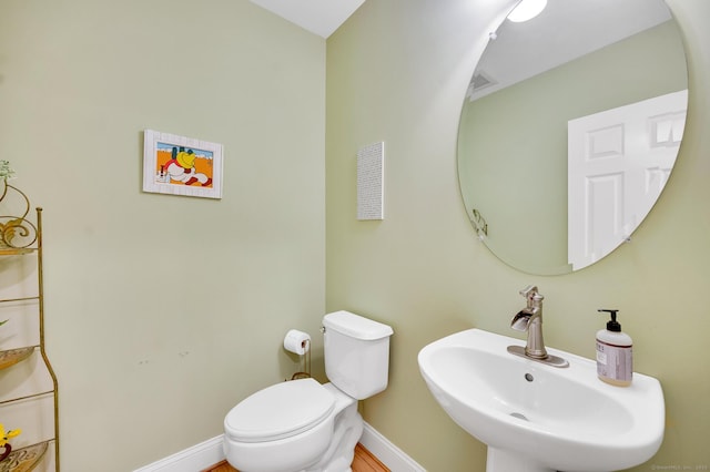 645 Prospect Ave Unit 11, West Hartford, CT 06105 - half bathroom with a sink, toilet, and baseboards