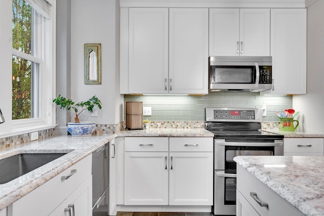 645 Prospect Ave Unit 11, West Hartford, CT 06105 - kitchen featuring appliances with stainless steel finishes, a sink, healthy amount of natural light, and white cabinets