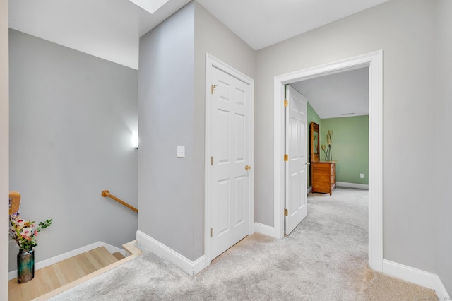 645 Prospect Ave Unit 11, West Hartford, CT 06105 - hall featuring an upstairs landing, baseboards, carpet flooring, and a skylight