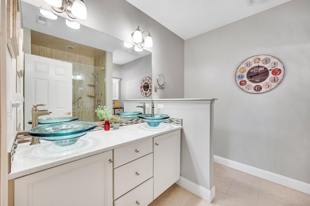 645 Prospect Ave Unit 11, West Hartford, CT 06105 - bathroom with tile patterned flooring, double vanity, a shower stall, and baseboards