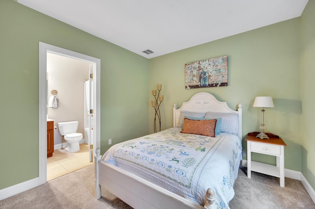 645 Prospect Ave Unit 11, West Hartford, CT 06105 - bedroom featuring light colored carpet, baseboards, and ensuite bathroom