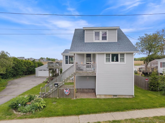 62 Surf Ave, Milford, CT 06460 - view of front of home with a garage, a shingled roof, a porch, an outdoor structure, and stairs