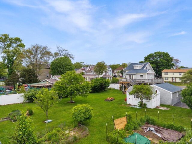 62 Surf Ave, Milford, CT 06460 - view of yard featuring an outdoor structure, a residential view, and a wooden deck