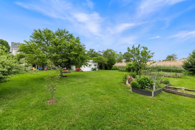 62 Surf Ave, Milford, CT 06460 - view of grassy yard featuring a vegetable garden