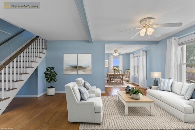 62 Surf Ave, Milford, CT 06460 - living area featuring a ceiling fan, stairs, wood finished floors, baseboards, and beam ceiling