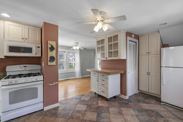 62 Surf Ave, Milford, CT 06460 - kitchen featuring white appliances, cream cabinets, baseboards, glass insert cabinets, and ceiling fan