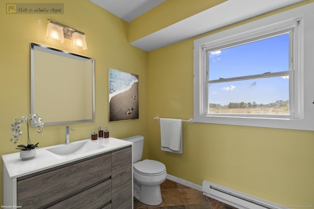 62 Surf Ave, Milford, CT 06460 - bathroom featuring a baseboard radiator, vanity, toilet, baseboards, and tile patterned floors