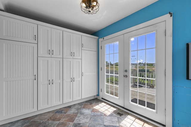 62 Surf Ave, Milford, CT 06460 - doorway to outside featuring french doors and dark stone finish floors