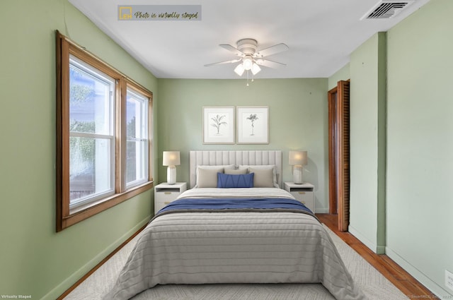 62 Surf Ave, Milford, CT 06460 - bedroom with baseboards, wood finished floors, and a ceiling fan