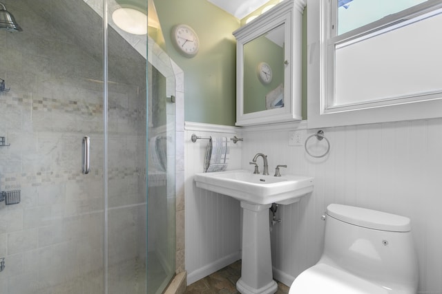 62 Surf Ave, Milford, CT 06460 - full bath with toilet, a shower stall, and wainscoting