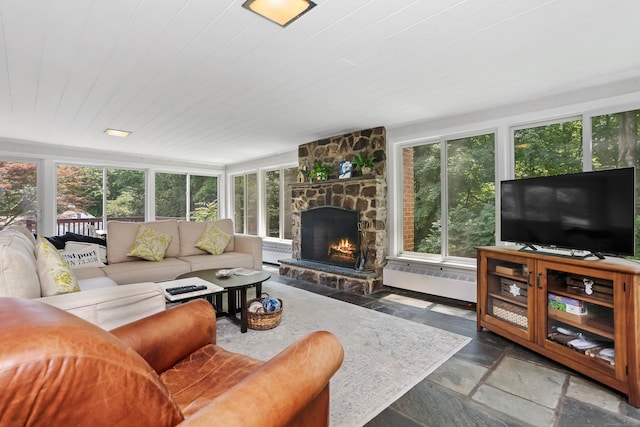 11 Overlook Rd, Westport, CT 06880 - living area featuring stone tile flooring, a fireplace, baseboard heating, and radiator heating unit