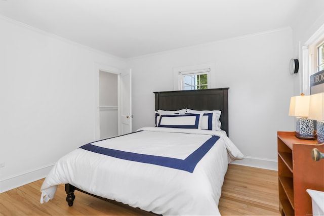 11 Overlook Rd, Westport, CT 06880 - bedroom with light wood-type flooring, multiple windows, and ornamental molding