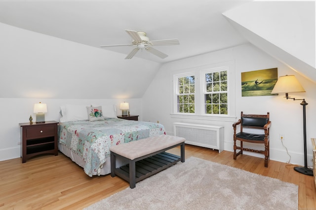 11 Overlook Rd, Westport, CT 06880 - bedroom with radiator, vaulted ceiling, wood finished floors, and ceiling fan