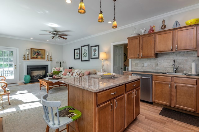 23 Anita Way, Warren, CT 06754 - kitchen featuring stainless steel dishwasher, a sink, a ceiling fan, backsplash, and brown cabinetry