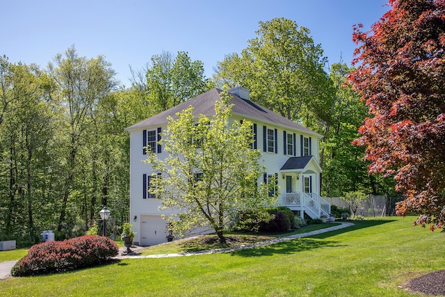 23 Anita Way, Warren, CT 06754 - colonial-style house with a chimney, a garage, and a front lawn