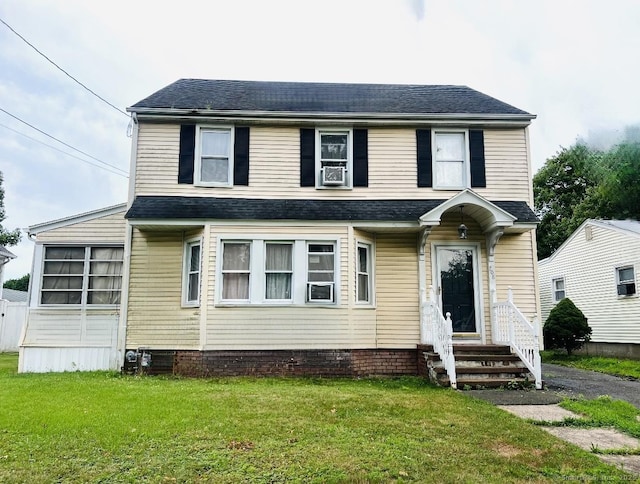 708 W Main St, West Haven, CT 06516 - view of front of home with entry steps, a front yard, and roof with shingles