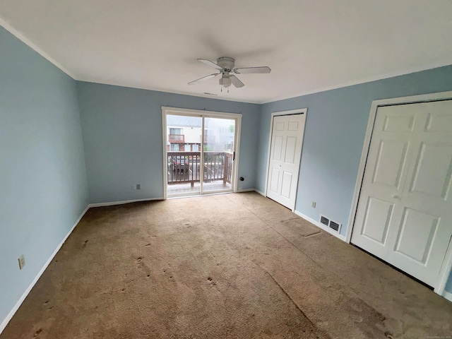 330 Short Beach Rd Apt F6, East Haven, CT 06512 - unfurnished bedroom featuring baseboards, carpet floors, access to exterior, and a ceiling fan