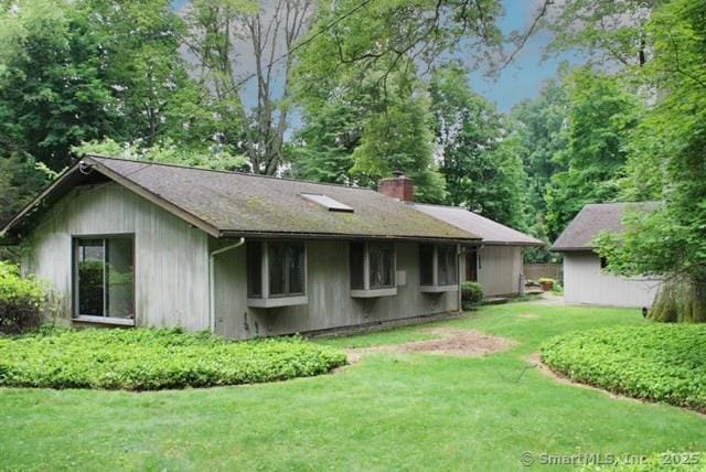 19 Harding Ln, Westport, CT 06880 - rear view of house with a chimney and a yard