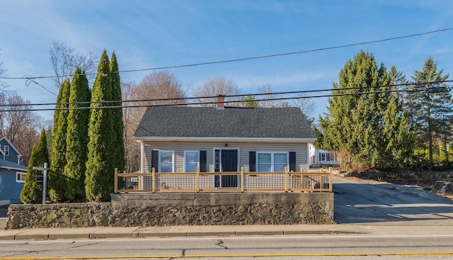 670 Putnam Pike, Rhode Island, RI 02828 - view of front of home with asphalt driveway and a chimney